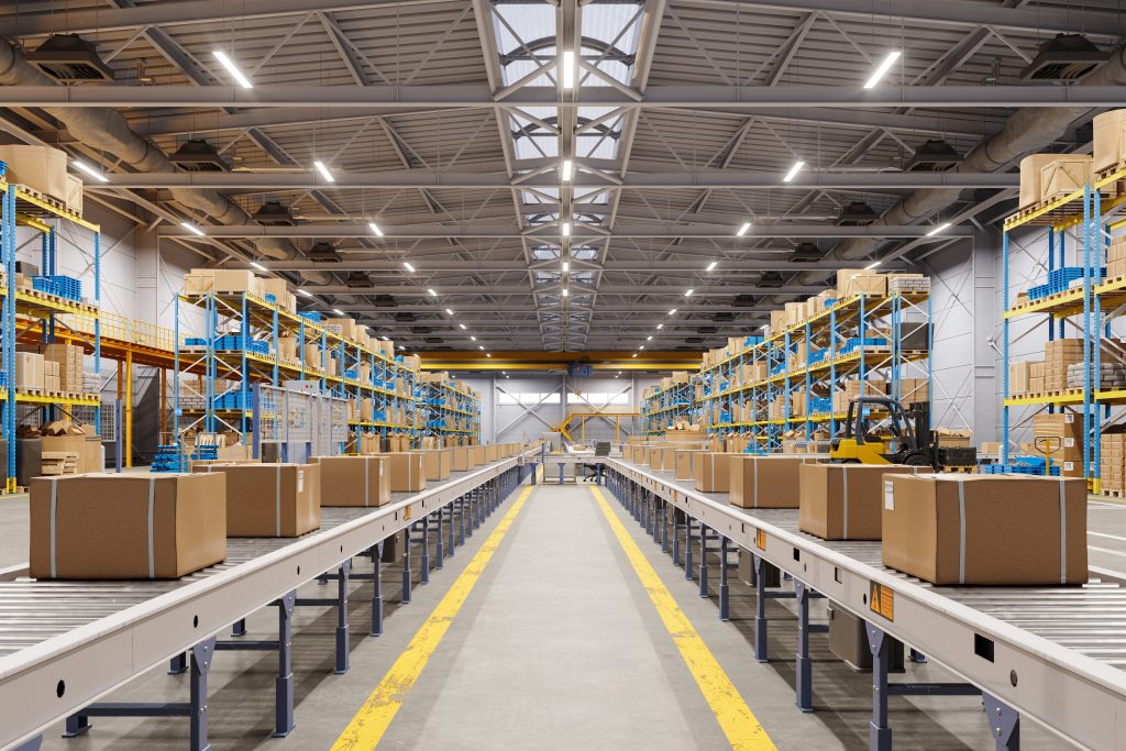 Close-up Of Cardboard Boxes On Conveyor Belt In Distribution Warehouse