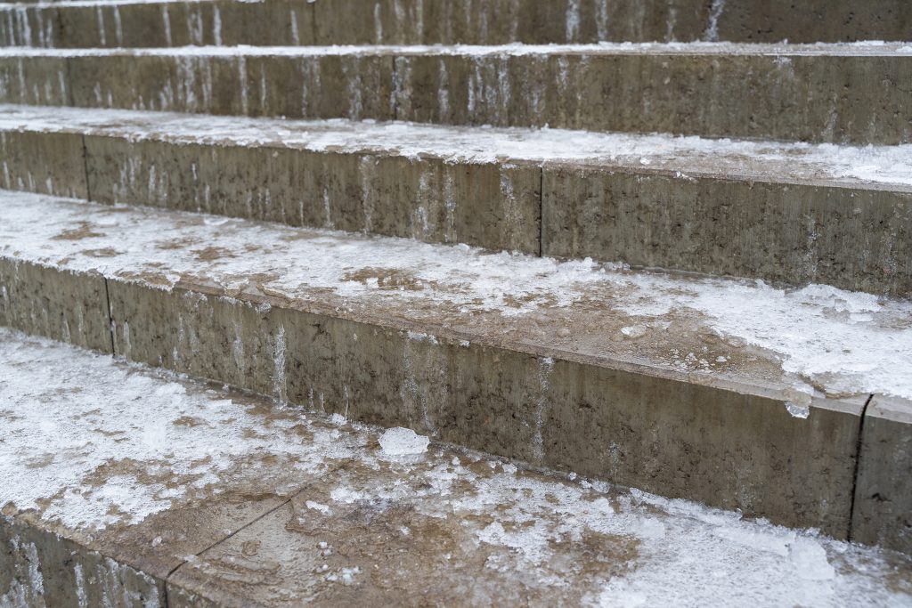 Drawing in moisture and triggering repeated freeze–thaw expansion.